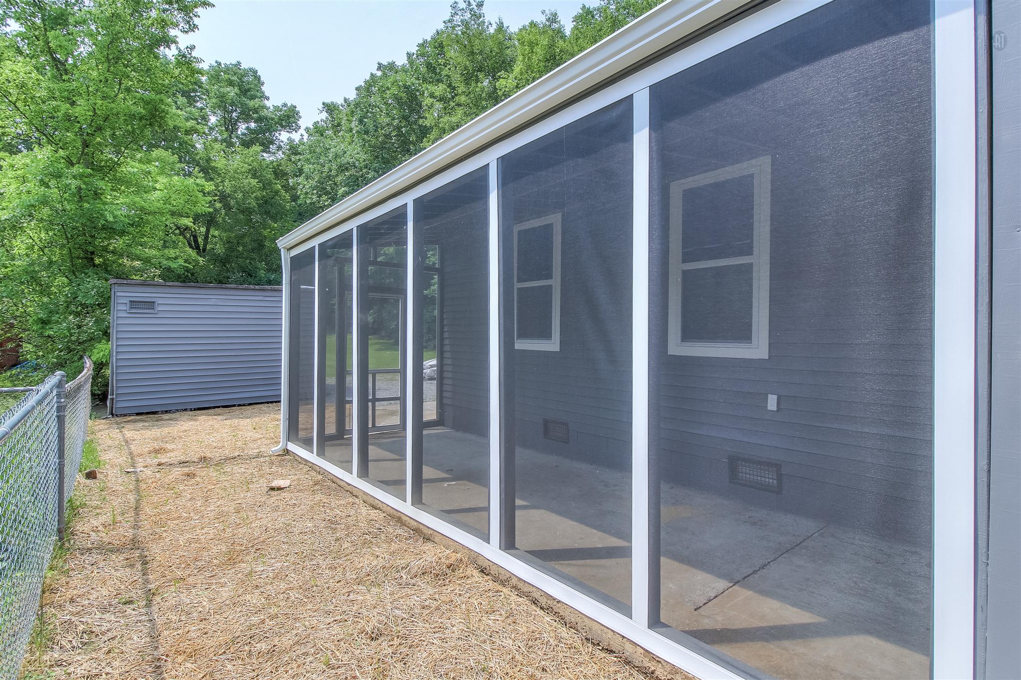 304 Warrior Road Madison, TN 37115 - Photo 14 of 16 Relax outdoors in the screened patio.