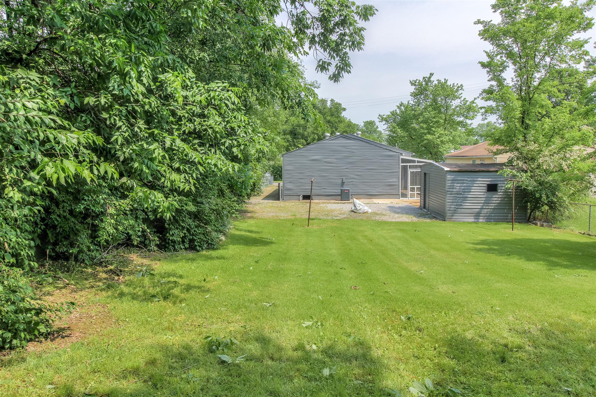 304 Warrior Road Madison, TN 37115 - Photo 15 of 16 This large back yard includes a storage shed plus room for all your outdoor activities.