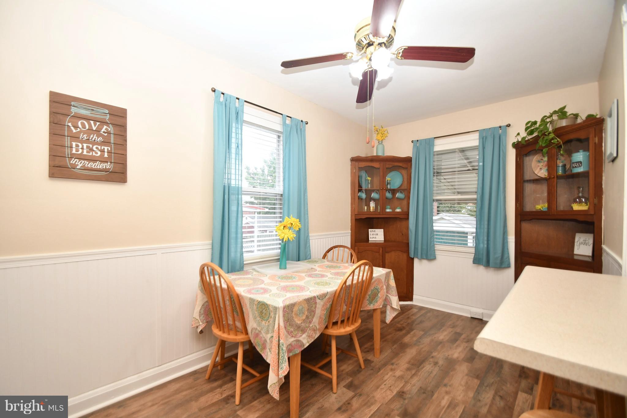 58 Berkshire Road Baltimore, MD 21221 - Photo 14 of 41 a view of a dining room with furniture window and wooden floor