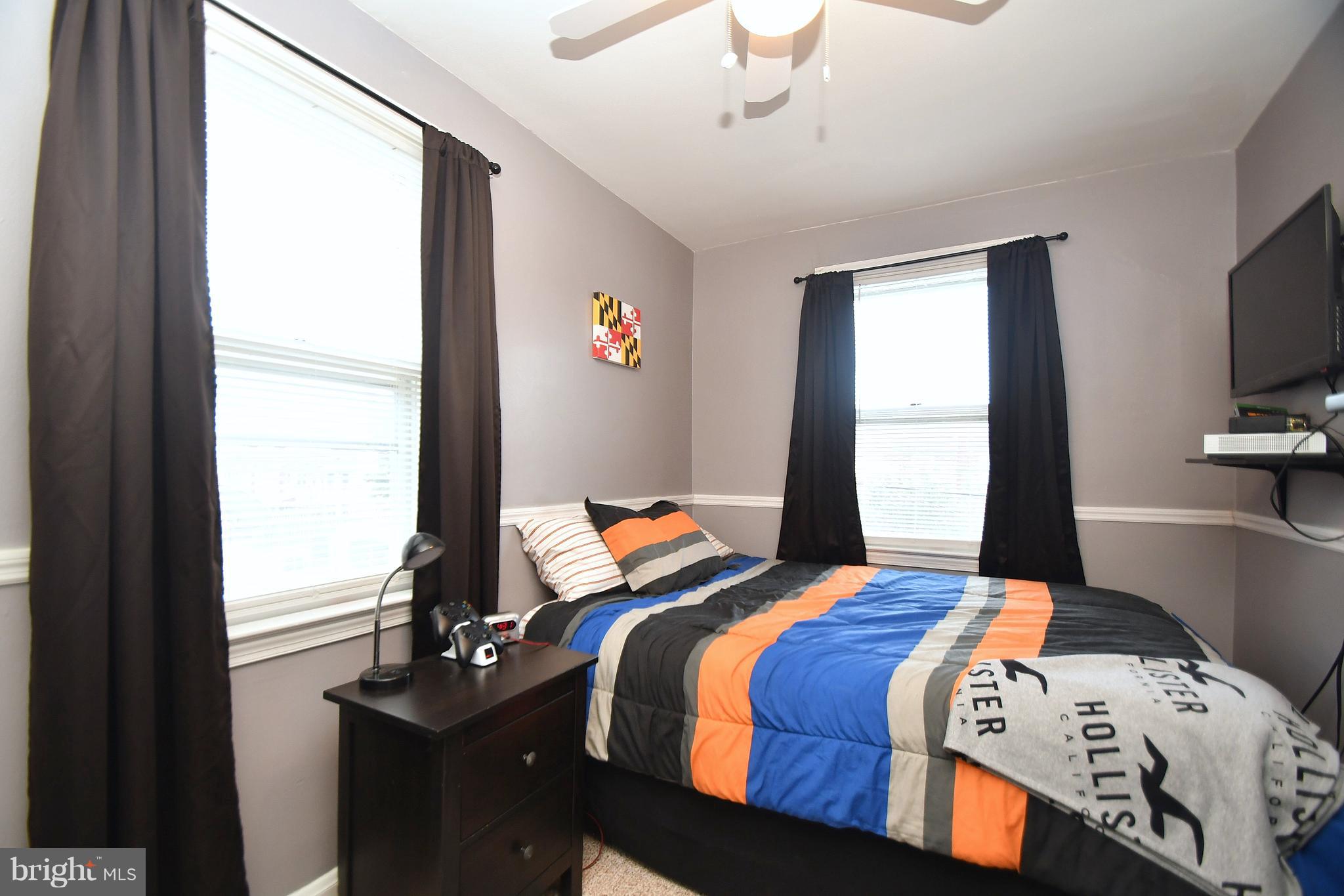 58 Berkshire Road Baltimore, MD 21221 - Photo 23 of 41 a bedroom with a bed and a window