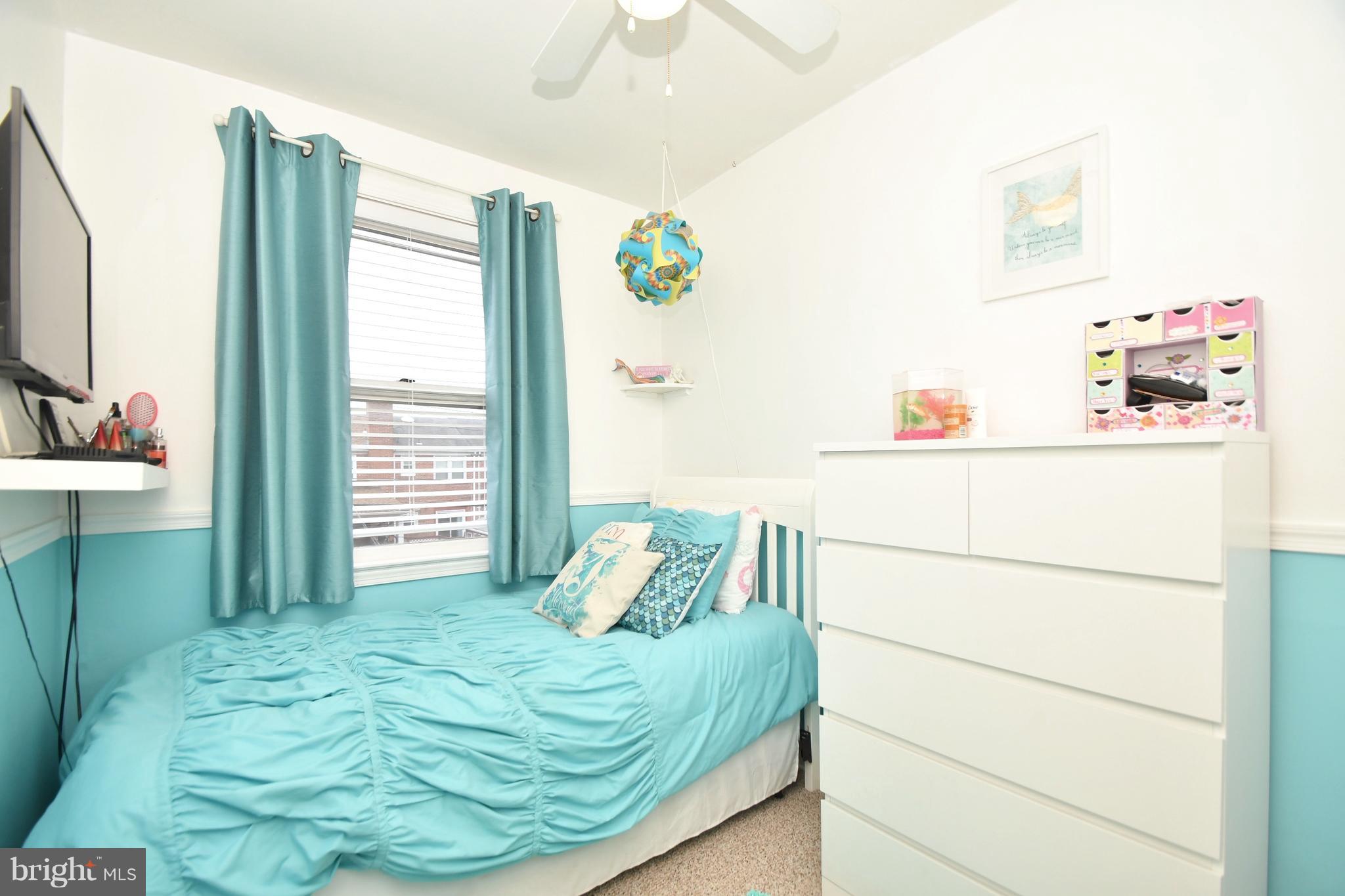 58 Berkshire Road Baltimore, MD 21221 - Photo 25 of 41 a bedroom with a bed and a dresser