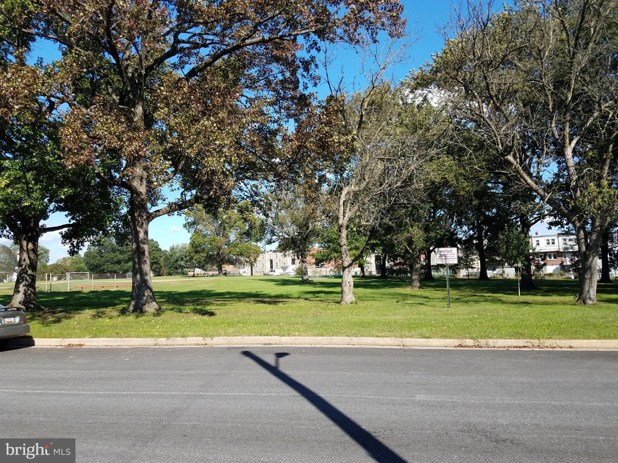 58 Berkshire Road Baltimore, MD 21221 - Photo 5 of 41 a view of a park with large trees