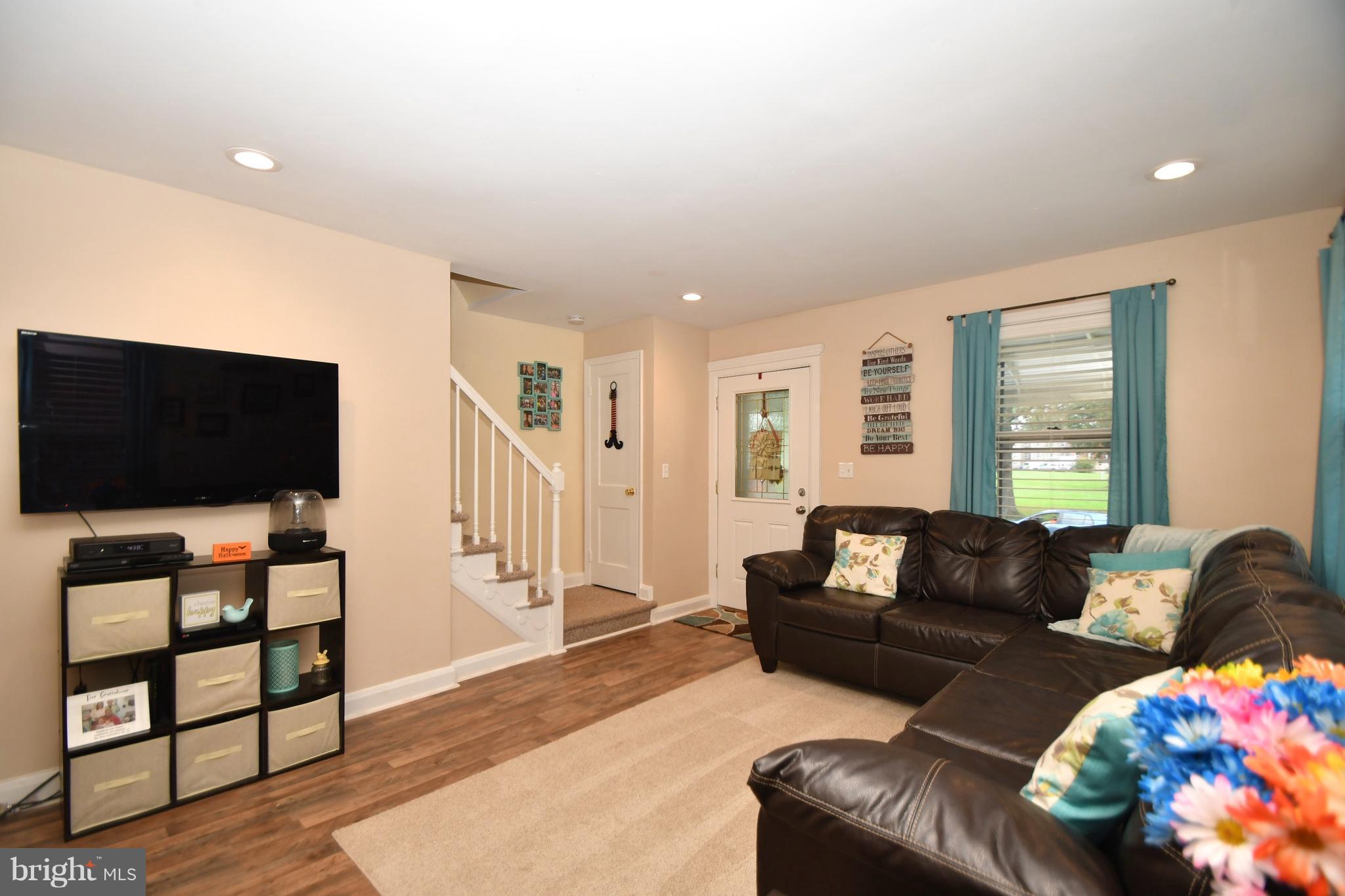 58 Berkshire Road Baltimore, MD 21221 - Photo 8 of 41 a living room with furniture and a flat screen tv
