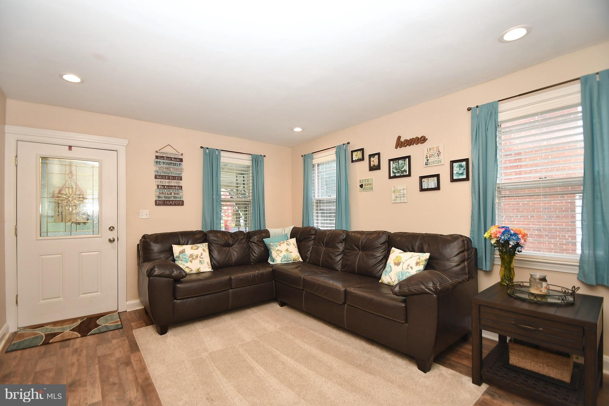 58 Berkshire Road Baltimore, MD 21221 - Photo 9 of 41 a living room with furniture and a flat screen tv