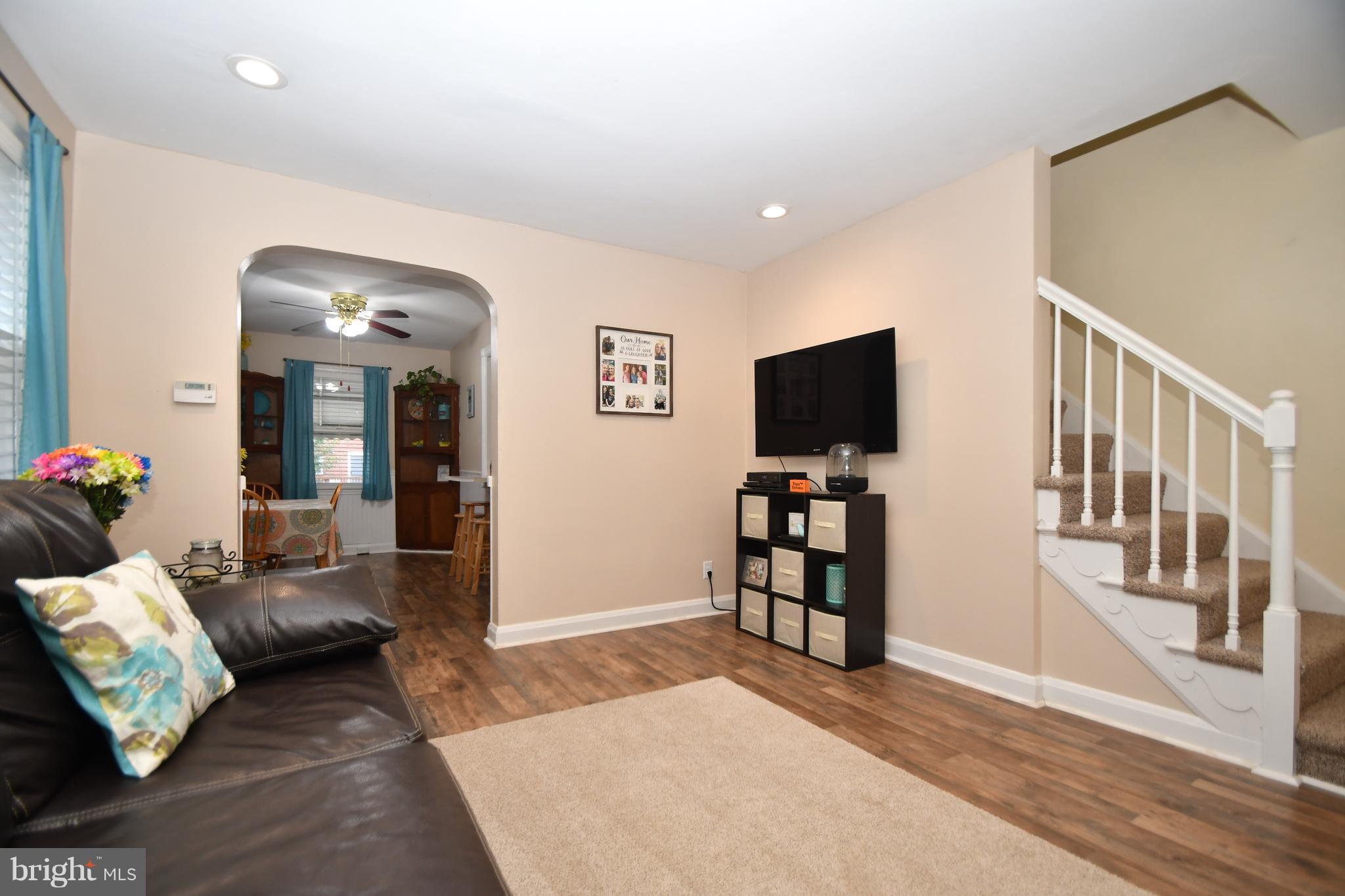 58 Berkshire Road Baltimore, MD 21221 - Photo 10 of 41 a living room with furniture and a flat screen tv