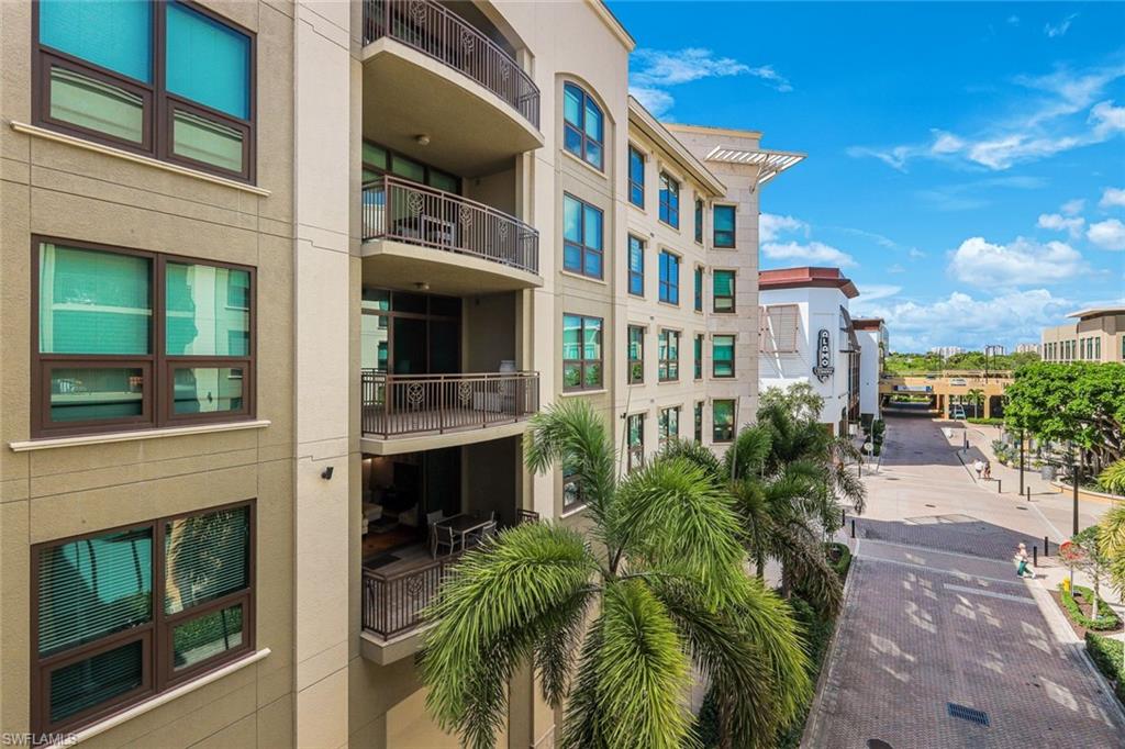 9123 Strada Place, Unit 7201 Naples, FL 34108 - Photo 21 of 50 a view of multiple houses with a yard