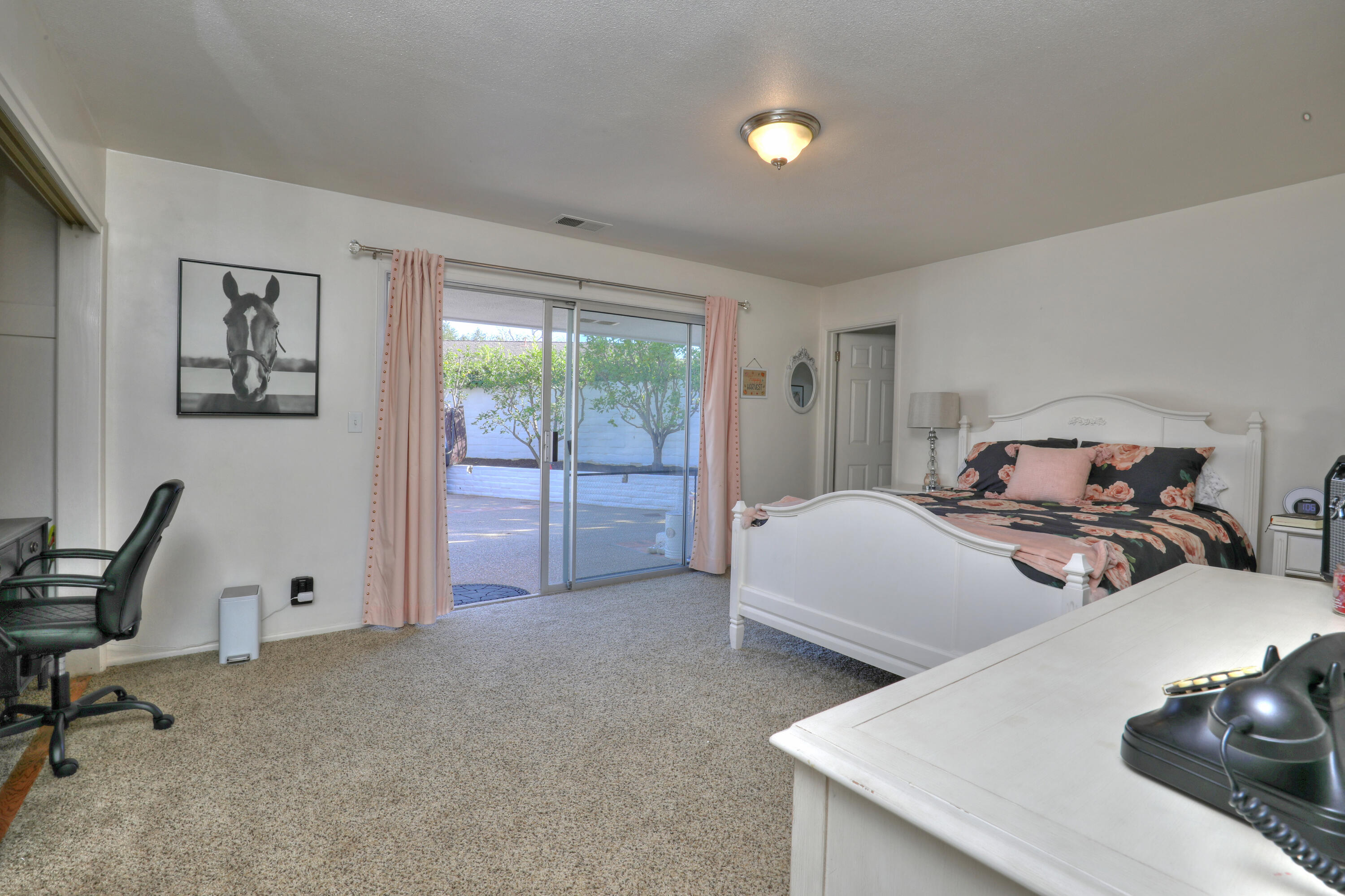 4620 Via Rubi Santa Barbara, CA 93105 - Photo 13 of 18 a bedroom with a bed and a table in it