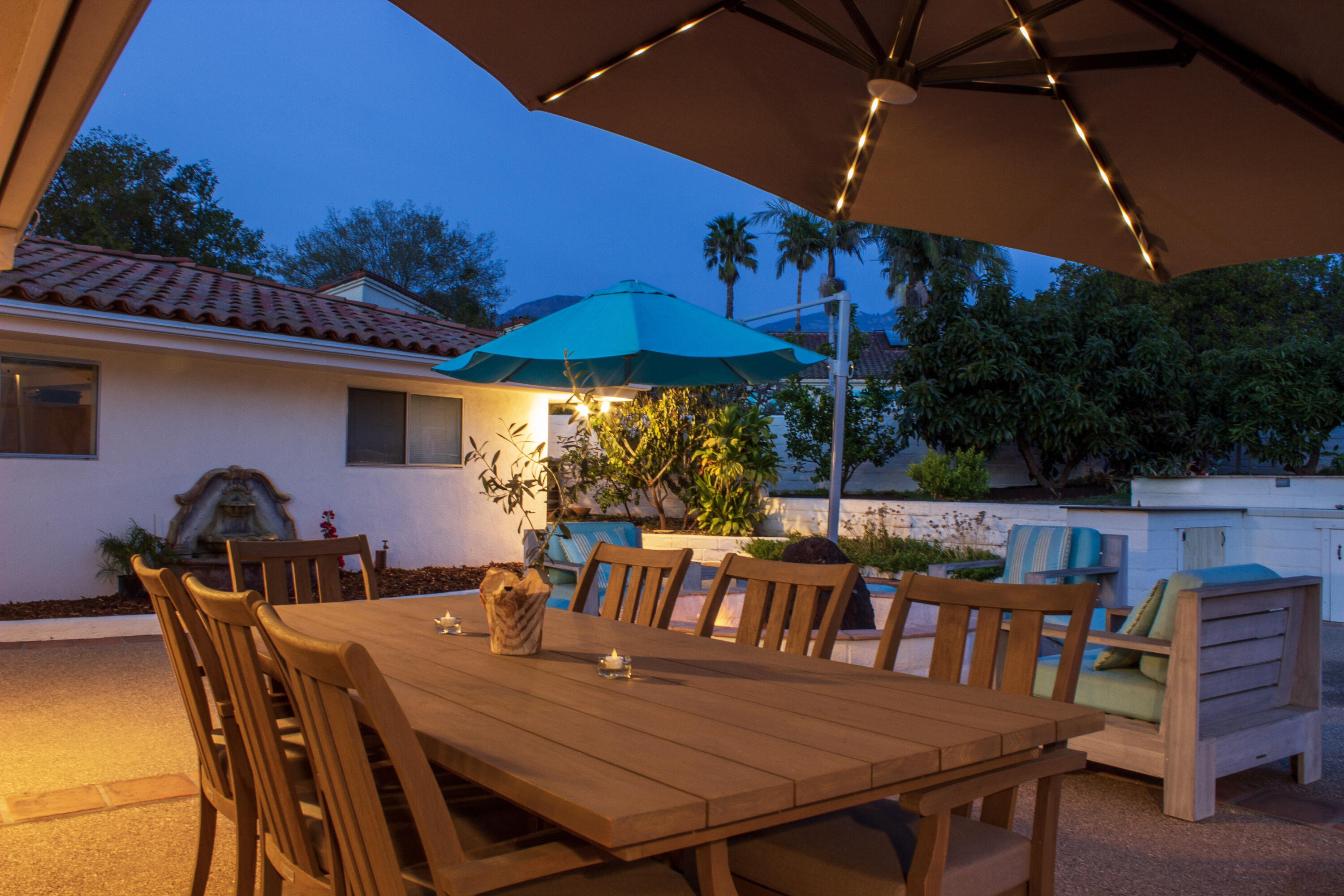 4620 Via Rubi Santa Barbara, CA 93105 - Photo 16 of 18 a view of a patio with table and chairs under an umbrella