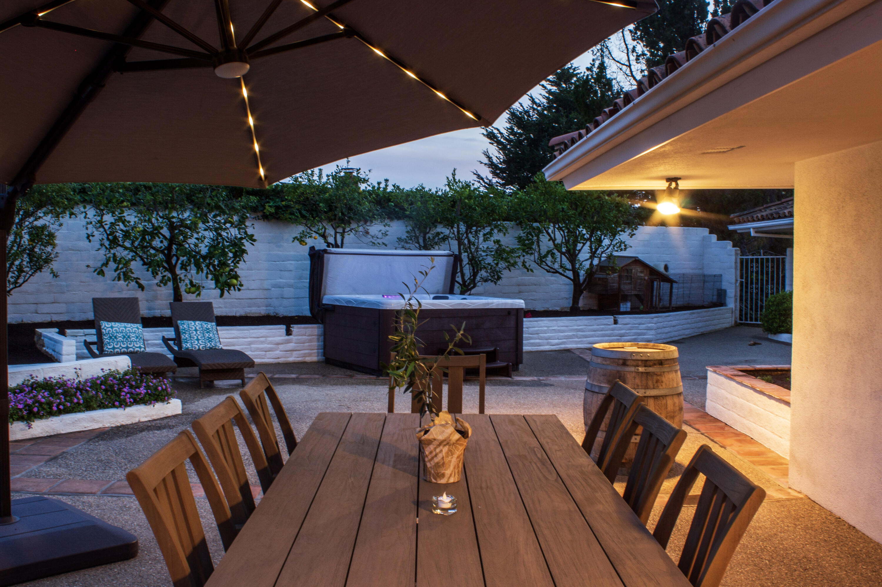 4620 Via Rubi Santa Barbara, CA 93105 - Photo 17 of 18 a view of a patio with table and chairs under an umbrella
