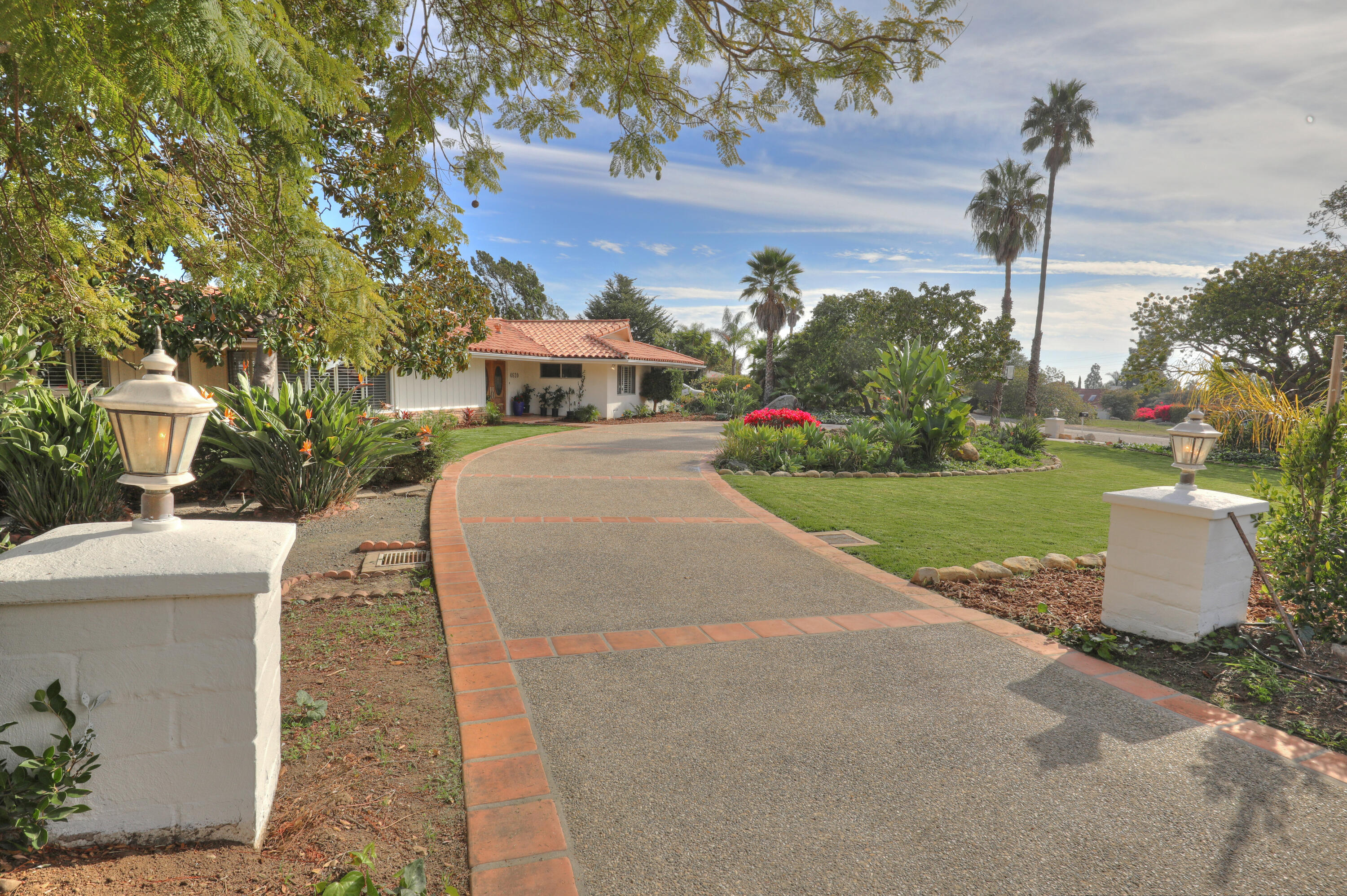 4620 Via Rubi Santa Barbara, CA 93105 - Photo 9 of 18 a front view of a house with a yard and garage
