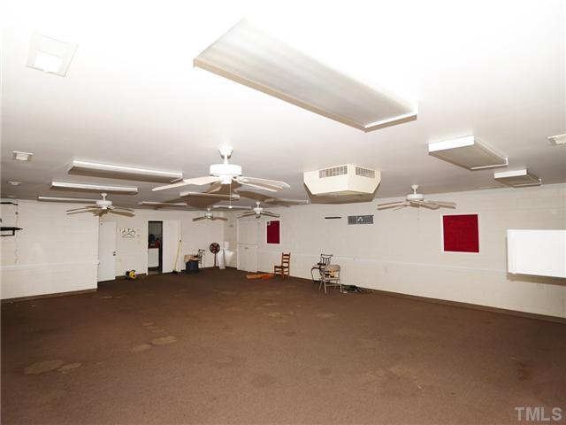 156 Bear Road Dunn, NC 28334 - Photo 5 of 17 Large Open Room with Ceiling Rans, LIght Fixtures, would be a great store or restaurant. Windows have been covered over