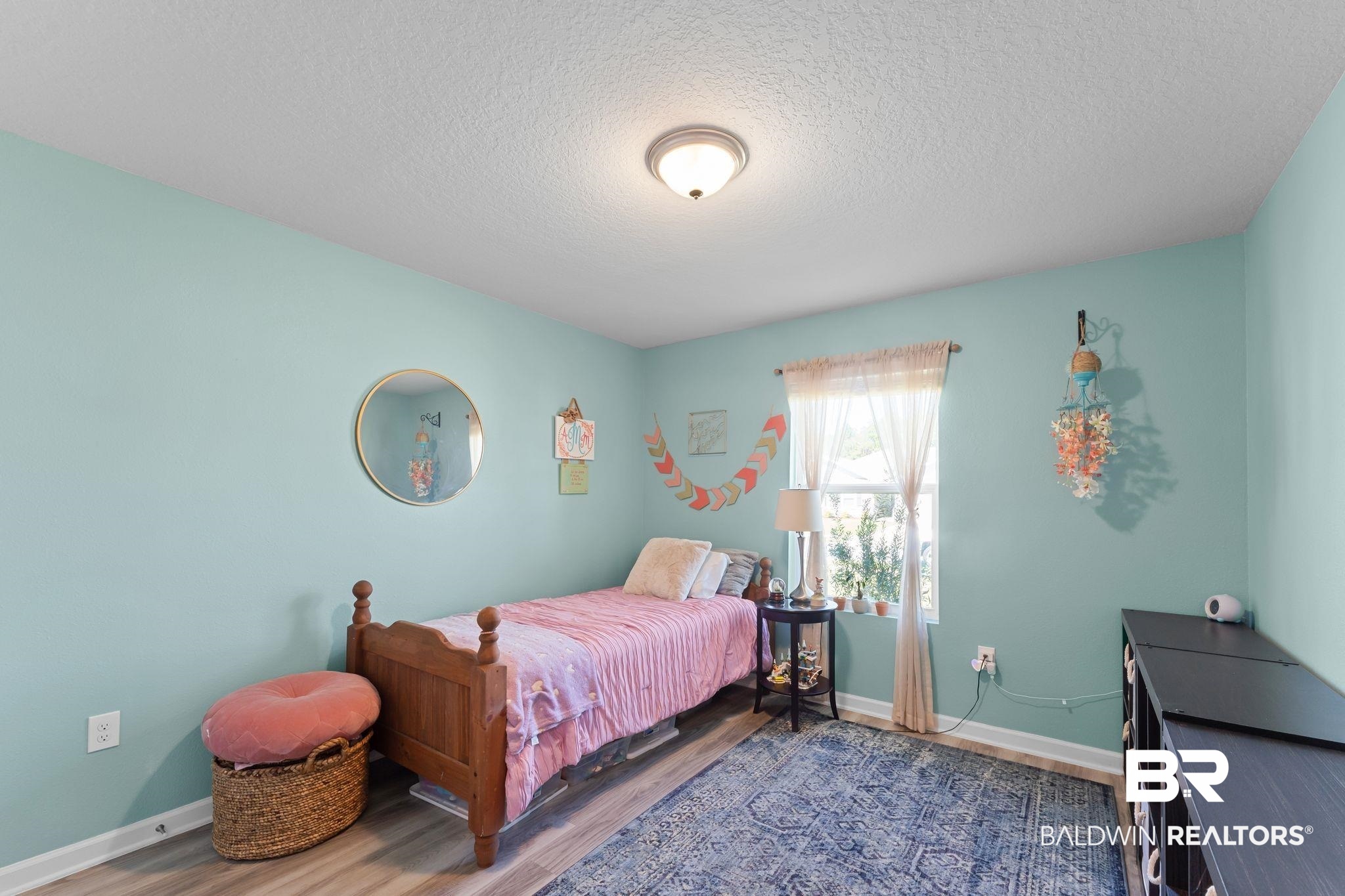 24337 Ringneck Loop Elberta, AL 36530 - Photo 25 of 34 Bedroom with wood finished floors and a textured ceiling