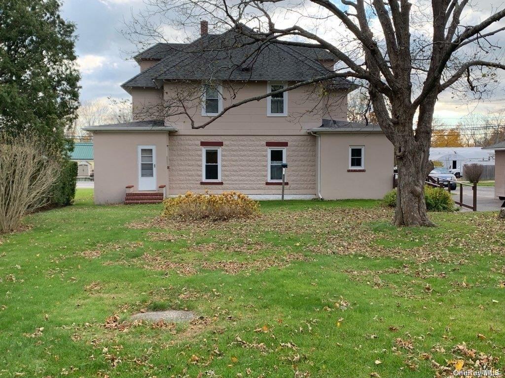 775 Hummel Avenue, Unit A Southold, NY 11971 - Photo 11 of 11 a front view of house with yard and trees