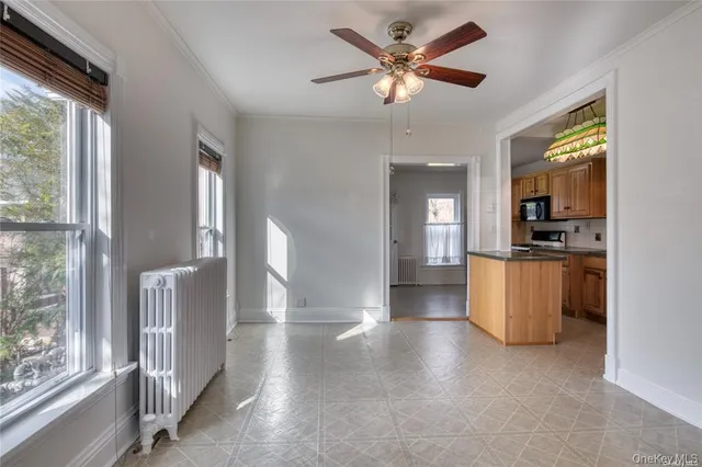 a view of a kitchen with a sink and a window