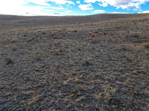 a view of a field with an outdoor space