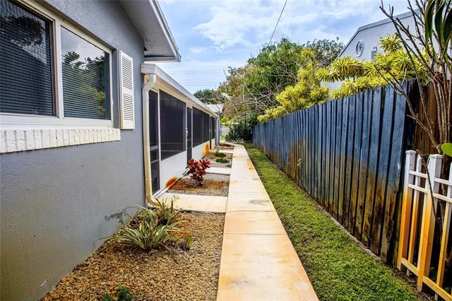 a view of balcony with wooden floor and potted plant
