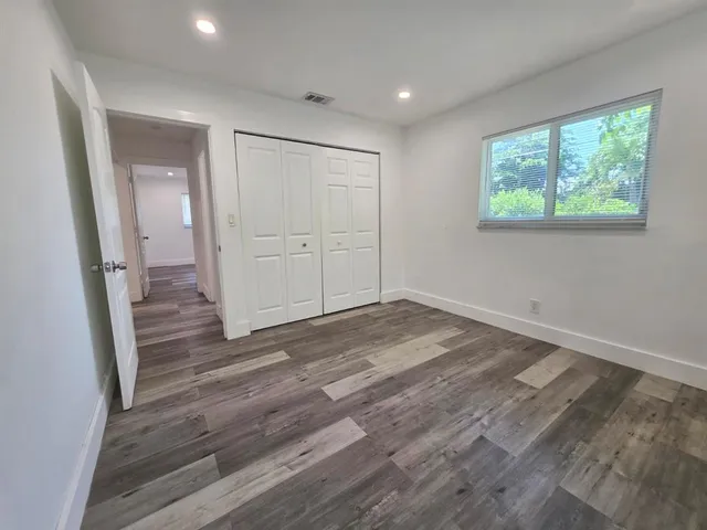a view of a pathway of a building from a balcony