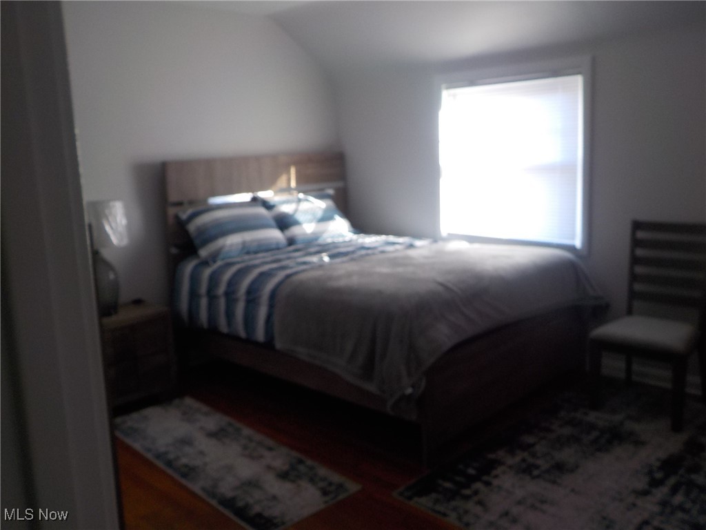 4031 Ardmore Road Cleveland, OH 44121 - Photo 13 of 19 Bedroom featuring lofted ceiling and dark wood-type flooring