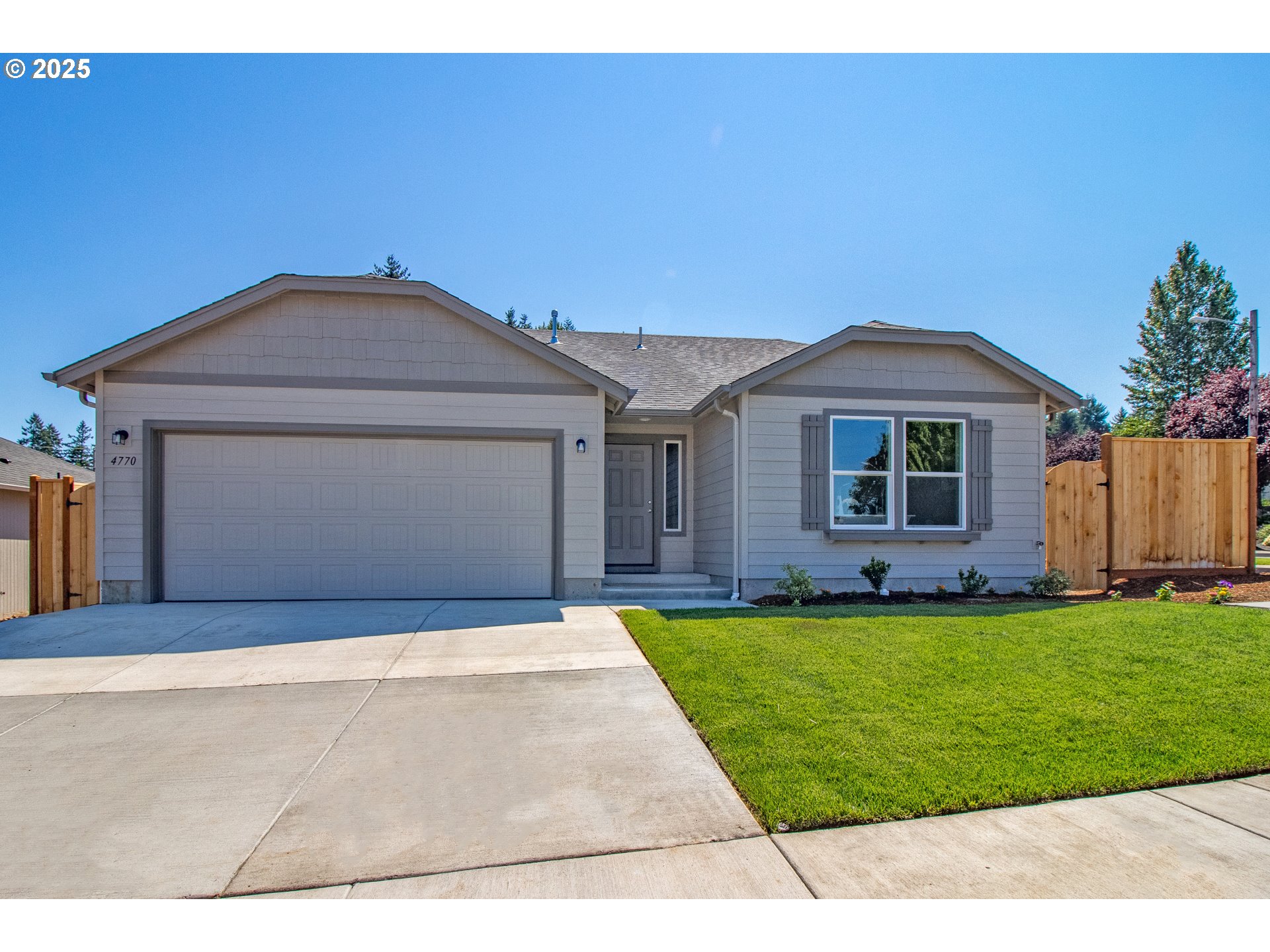 5242 Cedar View Drive Springfield, OR 97478 - Photo 1 of 1 a front view of a house with a garden