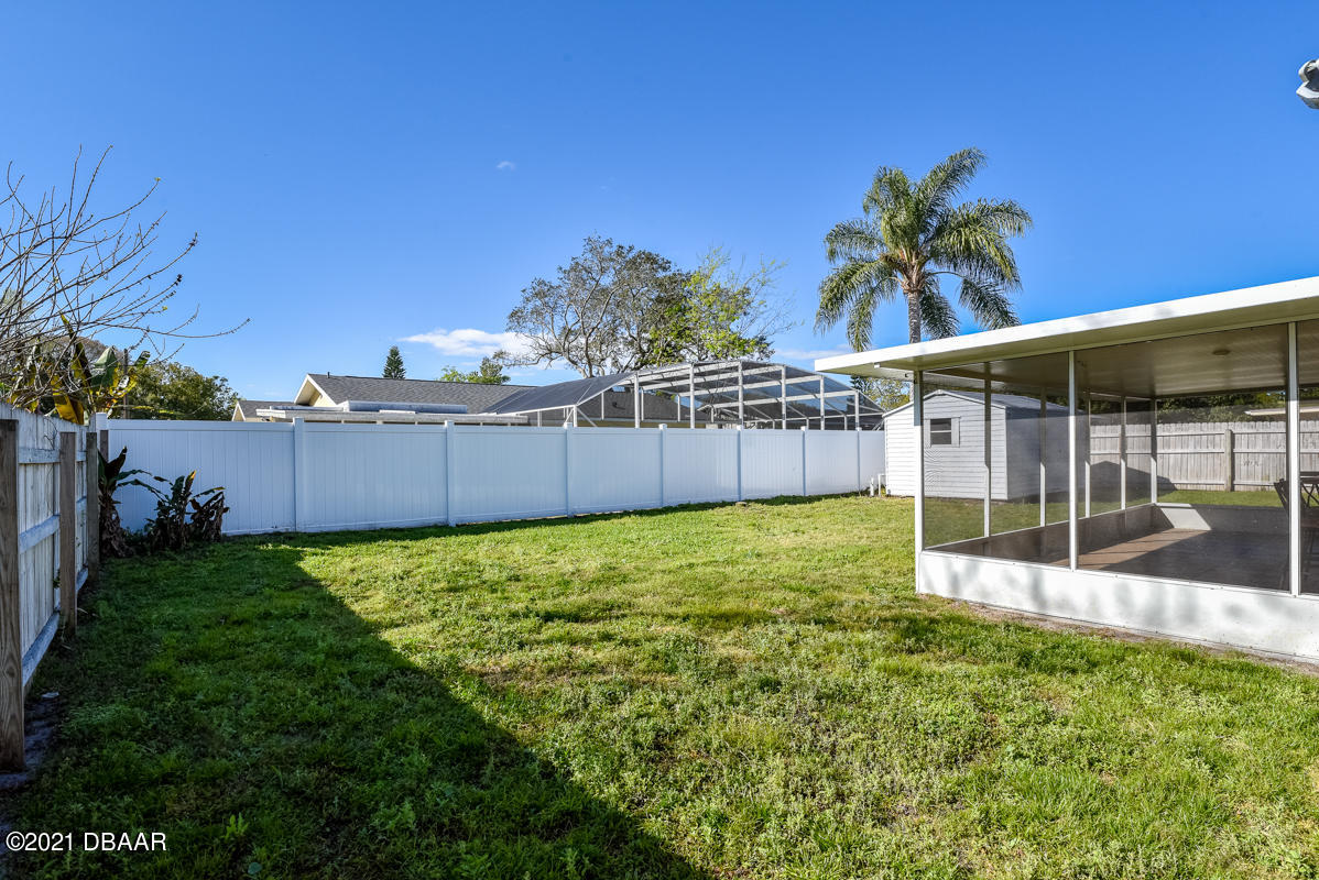 25 Tula Drive Port Orange, FL 32129 - Photo 13 of 49 a view of a backyard with potted plants and large tree