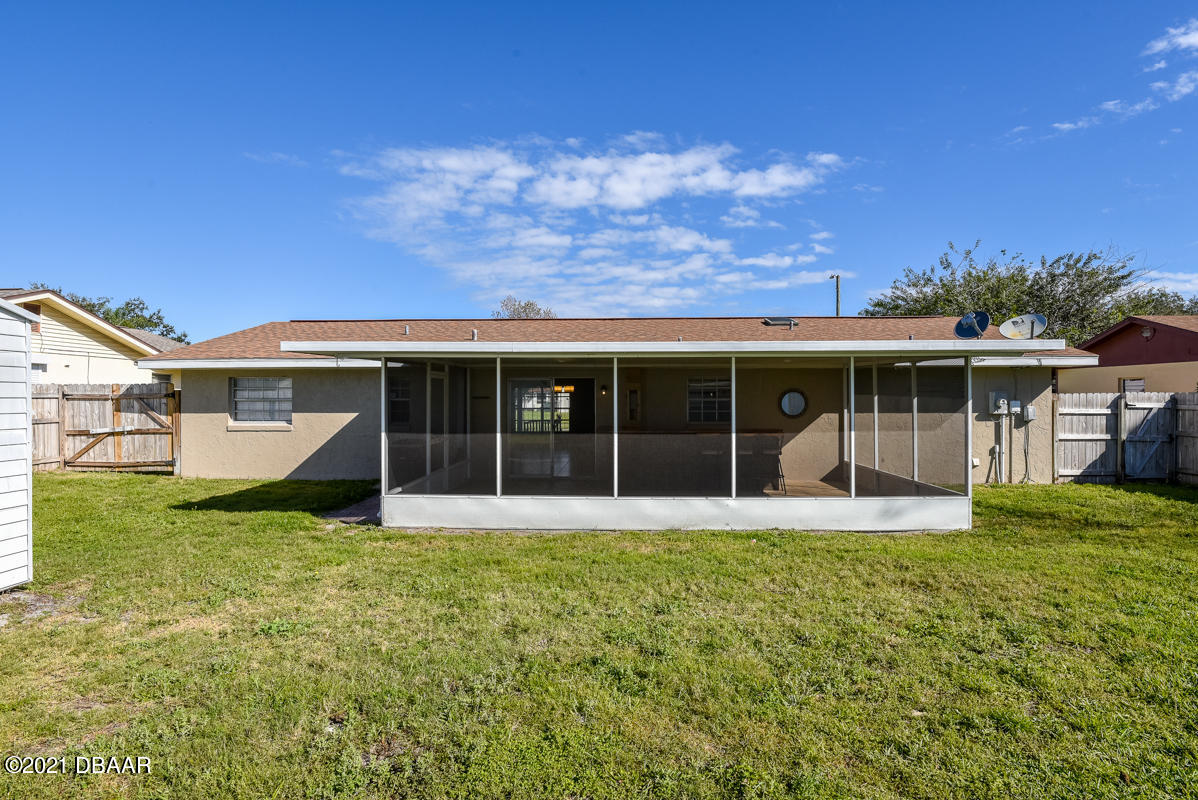 25 Tula Drive Port Orange, FL 32129 - Photo 14 of 49 a view of a house with a yard and sitting area