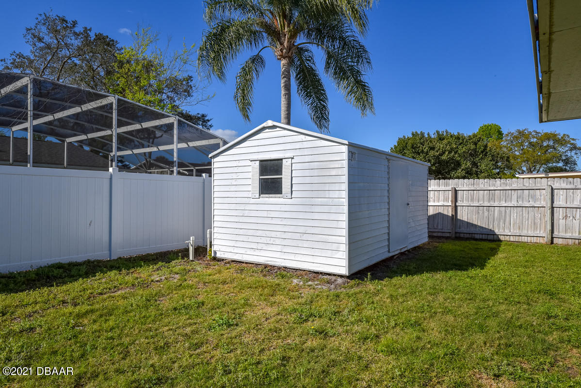 25 Tula Drive Port Orange, FL 32129 - Photo 15 of 49 front view of a house with a yard