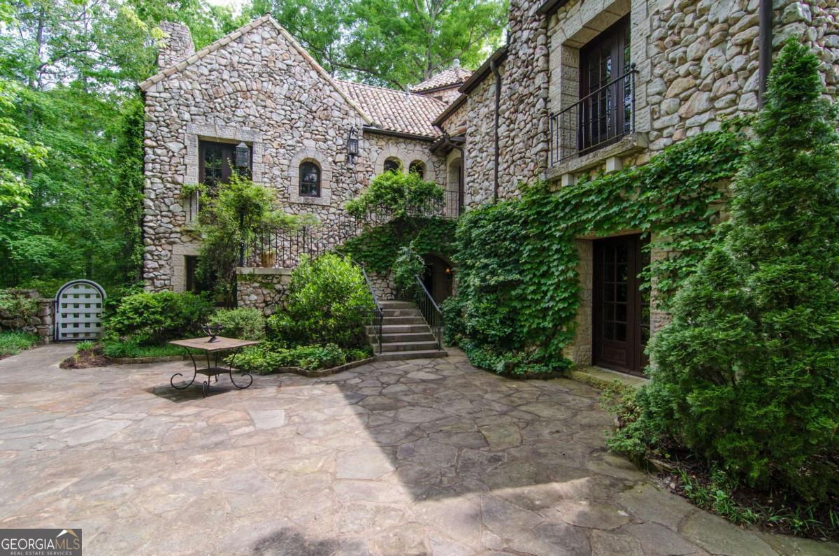 2100 West Wesley Road Northwest Atlanta, GA 30327 - Photo 14 of 53 front view of a house with a yard
