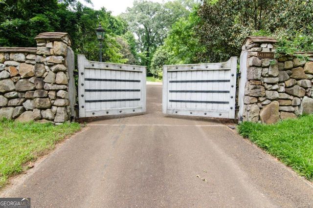a view of a wooden house with a street view
