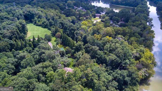 a view of a garden with a house