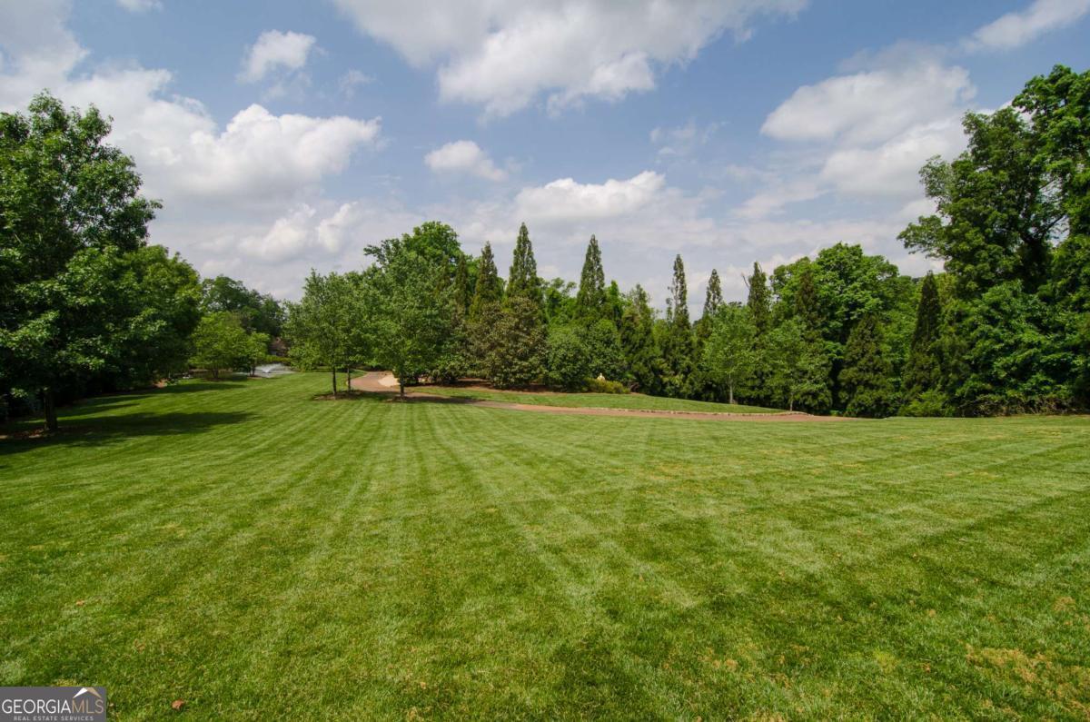 2100 West Wesley Road Northwest Atlanta, GA 30327 - Photo 7 of 53 a view of a golf course with a garden