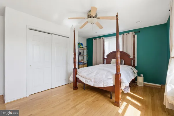 a bed room with a bed and a chandelier