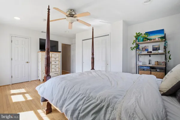 a bed room with a bed and a book shelf