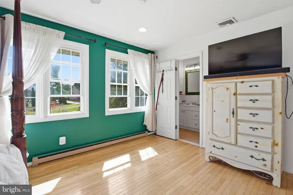a view of room with window and flat screen tv