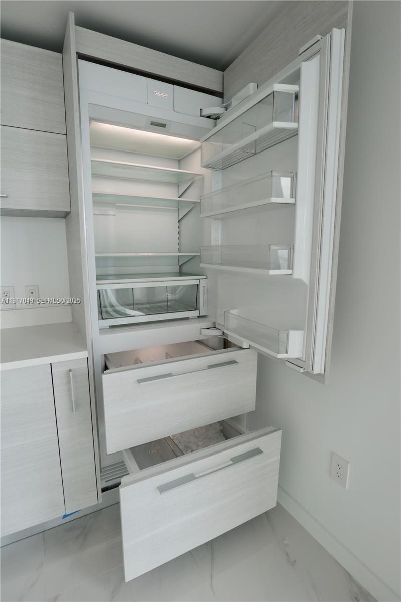 650 Northeast 32nd Street, Unit 1207 Miami, FL 33137 - Photo 17 of 30 a view with cabinets