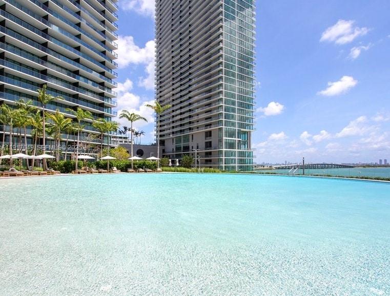 650 Northeast 32nd Street, Unit 1207 Miami, FL 33137 - Photo 24 of 30 a view of a big room with a plants and large trees