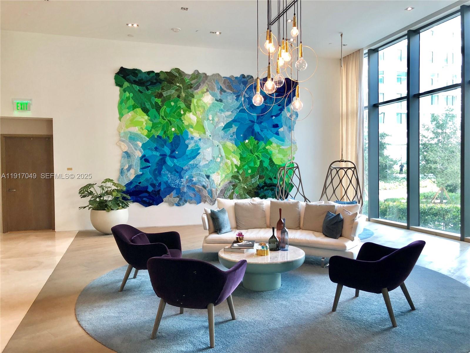 650 Northeast 32nd Street, Unit 1207 Miami, FL 33137 - Photo 29 of 30 a living room with furniture and a large window