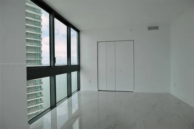 a bathroom with a sink double vanity and a mirror