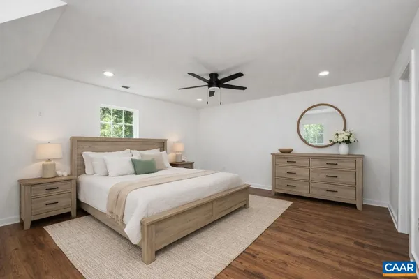 a bedroom with a bed and a dresser