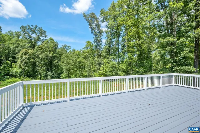 a view of a balcony with wooden floor
