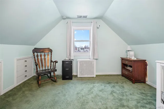 a view of workspace with furniture and window