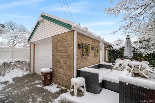 a view of a patio with couches table and chairs and potted plants