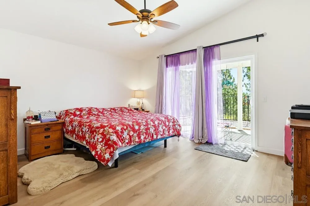 2501 Columbine Road Alpine, CA 91901 - Photo 15 of 44 a bedroom with a bed and large window