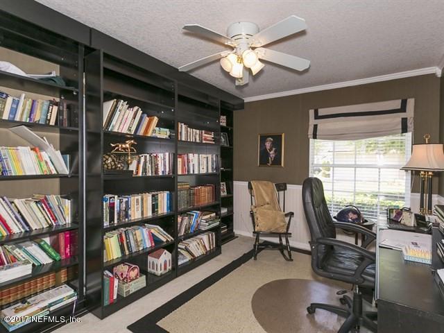 1204 Ribbon Road St. Johns, FL 32259 - Photo 12 of 26 a view of a livingroom with furniture and a bookshelf