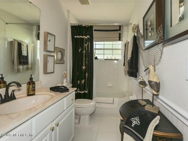 1204 Ribbon Road St. Johns, FL 32259 - Photo 14 of 26 a bathroom with a sink toilet a mirror and shower