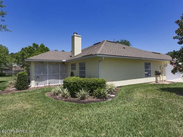 1204 Ribbon Road St. Johns, FL 32259 - Photo 17 of 26 a front view of a house with a garden