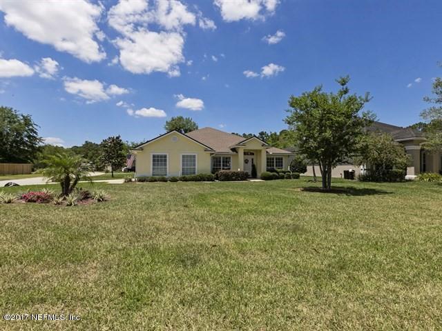 1204 Ribbon Road St. Johns, FL 32259 - Photo 18 of 26 a front view of a house with a yard