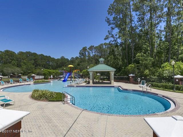 1204 Ribbon Road St. Johns, FL 32259 - Photo 22 of 26 a view of a swimming pool and trees in the background