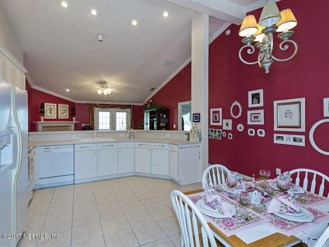 1204 Ribbon Road St. Johns, FL 32259 - Photo 6 of 26 a kitchen with stainless steel appliances granite countertop a sink and cabinets