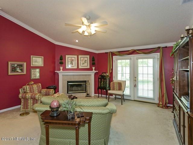 1204 Ribbon Road St. Johns, FL 32259 - Photo 8 of 26 a living room with furniture and a fireplace