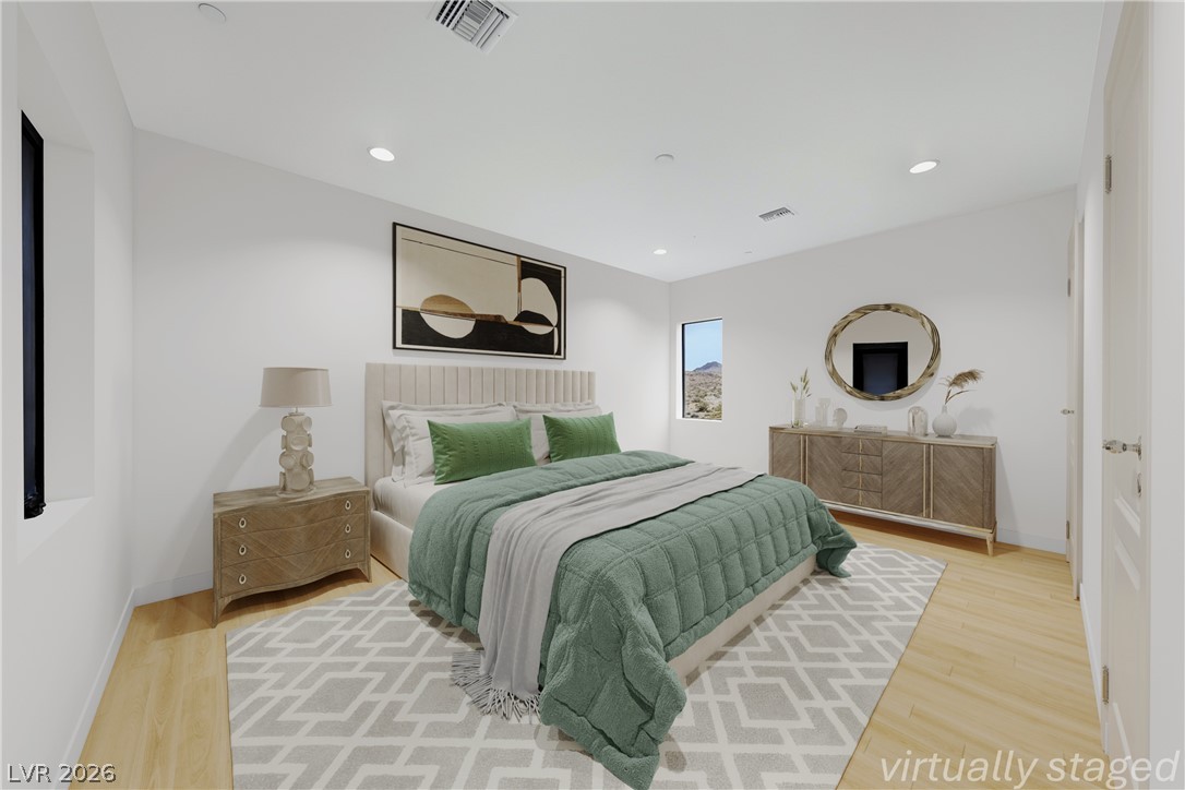 1140 Julie Road Henderson, NV 89002 - Photo 39 of 85 A generously proportioned bedroom features recessed lighting and myn views offering a comfortable personal retreat.1140 JULIE Rd Henderson NV 89002 Virtually staged